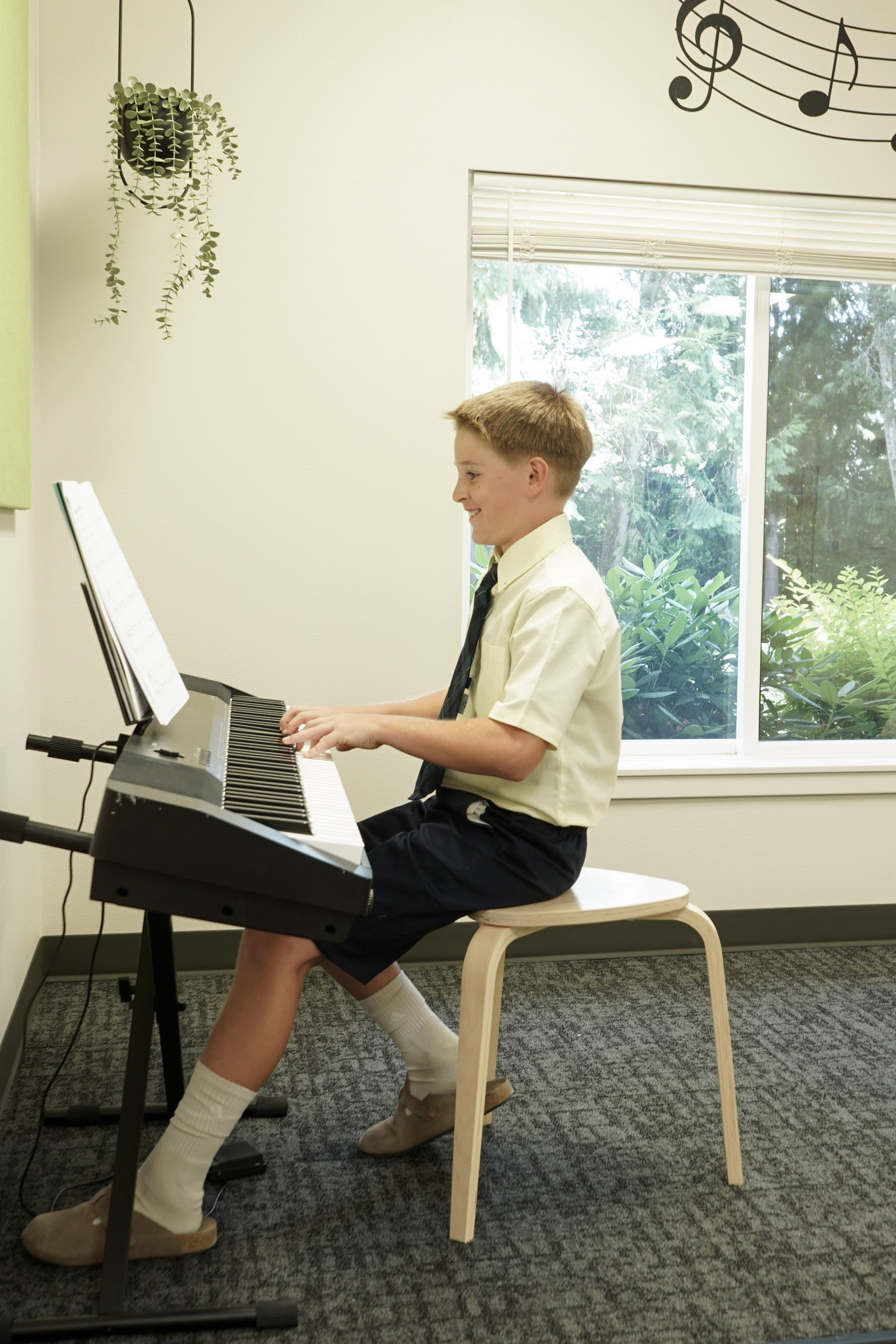 A child at a piano lesson
